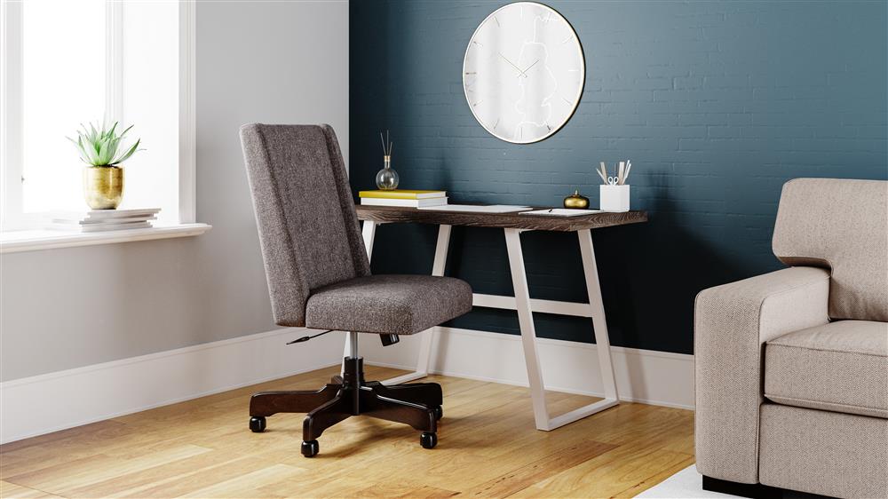 small scale desk in corner of room